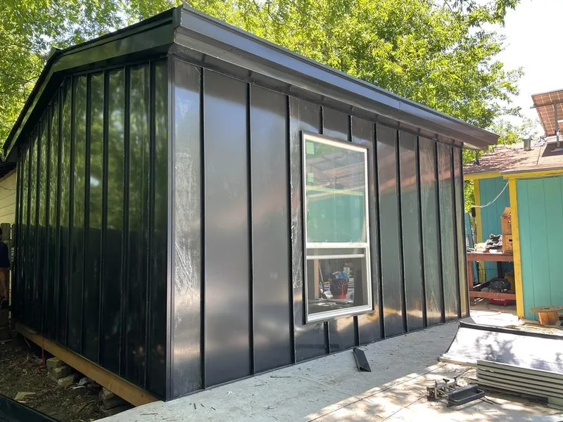 Black standing seam metal wall panels for Metal Roof Installation in Trinity